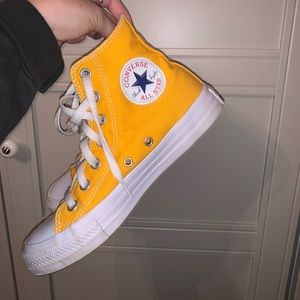 Yellow high top converse